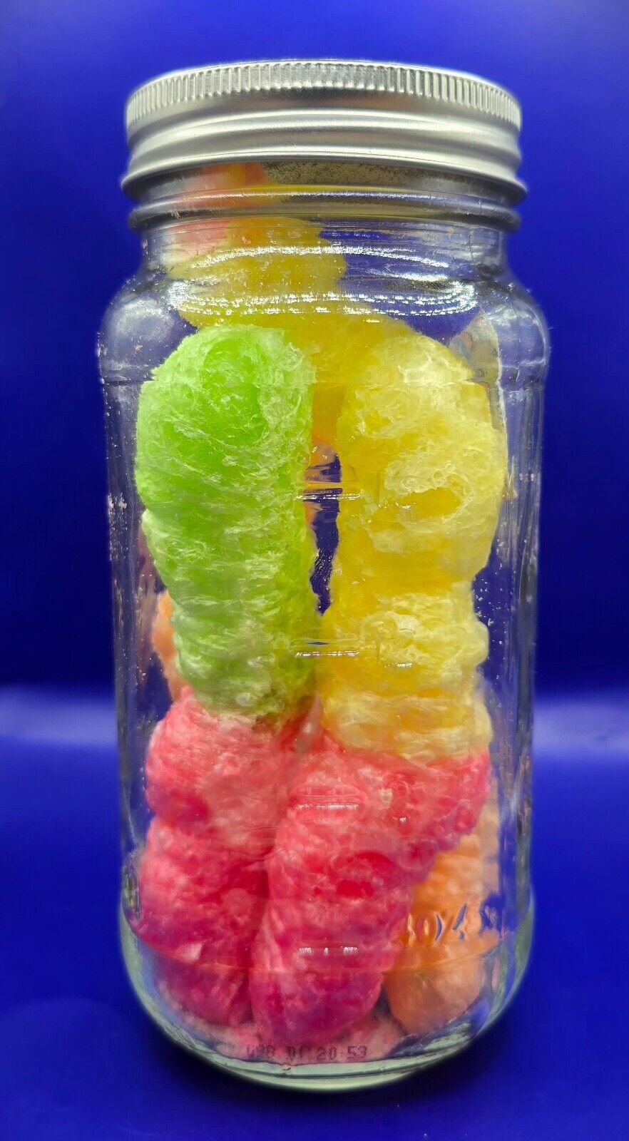 freeze dried gummy worms in a 16oz in ventage atlas mason jar