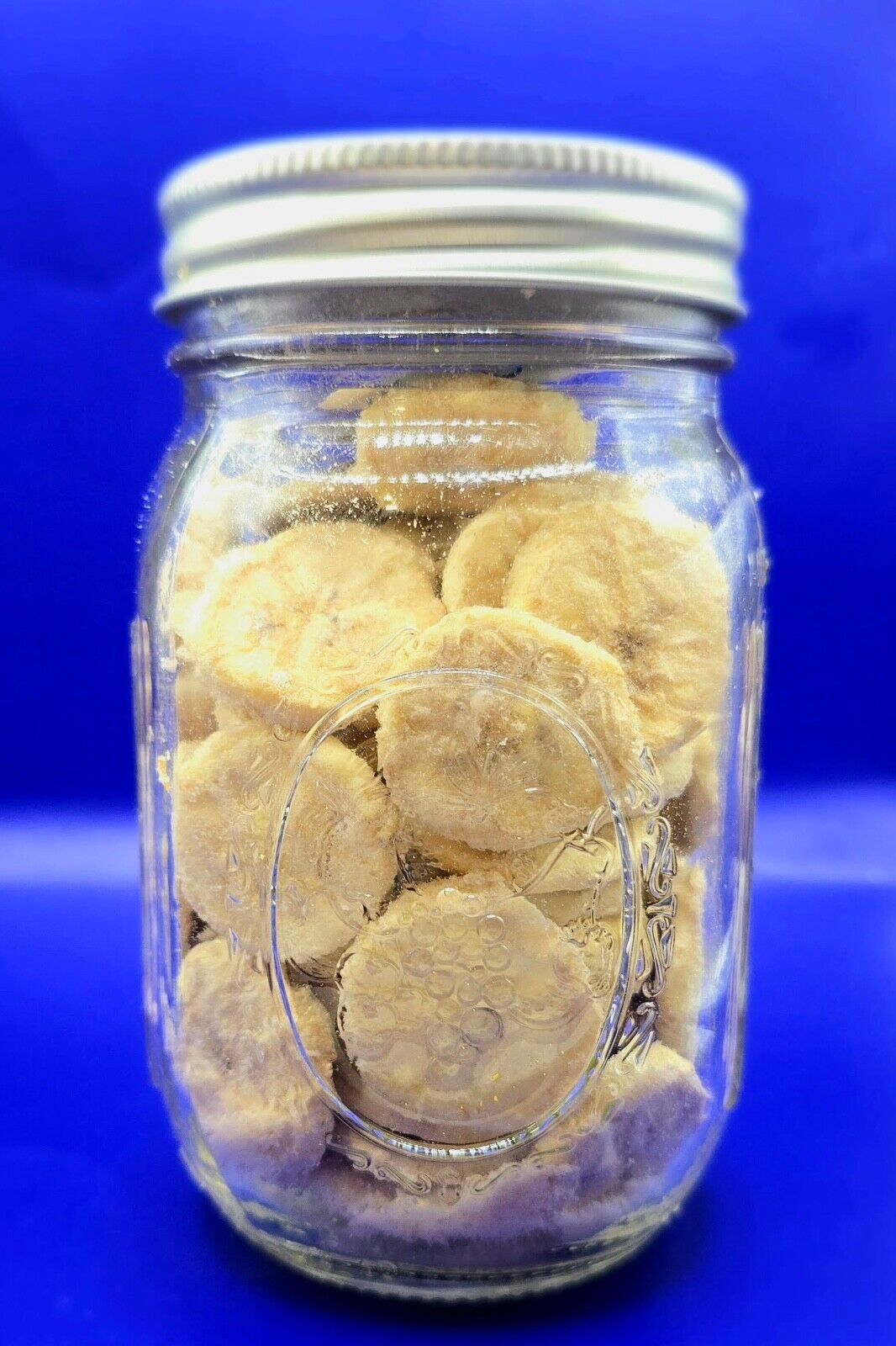 freeze dried banana chips in a 12 oz mason jar