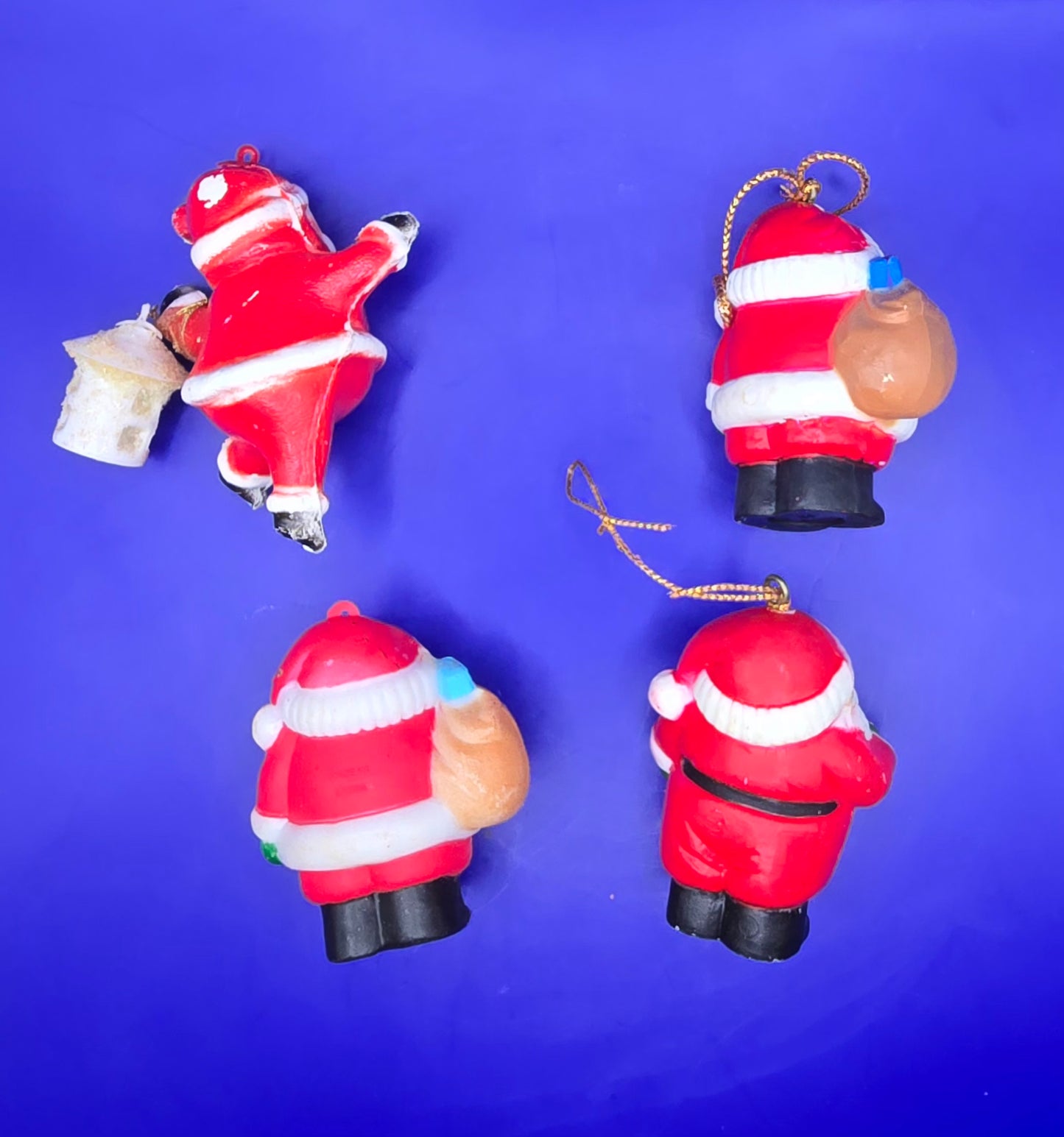 Four Vintage Santa Ornaments