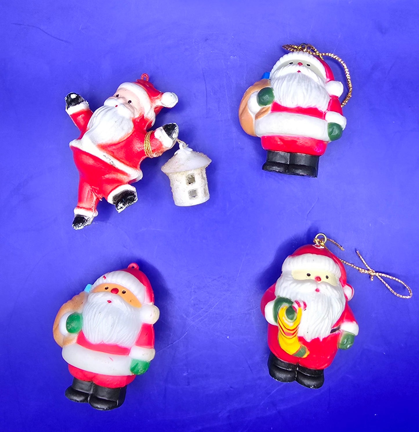 Four Vintage Santa Ornaments